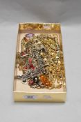 A variety of ladies costume jewellery, including amber glass pendant and necklaces.
