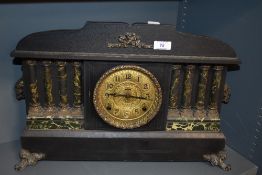 A 20th century reproduction Victorian style mantel clock, having architectural style.
