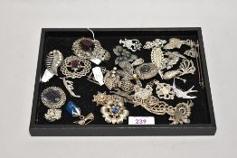 An assorted collection of white metal jewellery and brooches, to include a Celtic style brooch