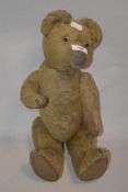 A vintage sawdust filled teddy bear.