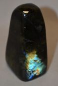 A polished labradorite paperweight.