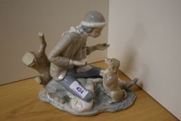 A NAO figurine, Boy with dog.