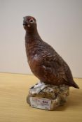 A Royal Doulton Famous Grouse Liquor bottle.