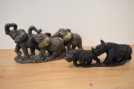 Two 20th Century stone carved and textured rhinoceros and elephant ornaments, the largest