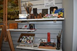 A quantity of artist's equipment and materials, including paint brushes, printing blocks, pastels,