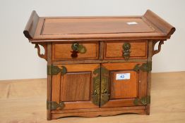A 19th/20th Century Chinese hardwood altar cabinet, of pagoda shape, measuring 26cm x 35cm x 20cm