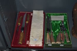 Two vintage cases of horn handled serving sets.