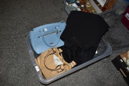 Two handbags, one of blue PVC by David Jones and the other Beige leather by Tiganello, both appear
