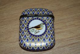 A 19th/20th Century French enamelled match box, the body decorated with printed depictions of birds,