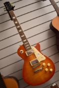 A Tanglewood TSB58 electric guitar, Honeyburst finish, with Cobra case in yellow tweed