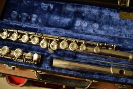 A traditional silvered flute, stamped Emerson, USA
