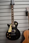 A gear4music Les Paul style electric guitar