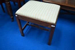 A 19th Century mahogany dressing table stool having later upholstered seat