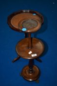 A reproduction wine table and a vintage smokers stand