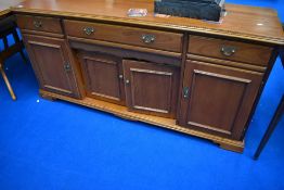 A good quality modern dining set by Younger, comprising extending table , four chairs and sideboard