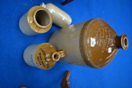 A selection of salt glazed flagons, some named
