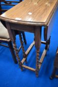 A mid 20th Century oak twist gate leg occasional table