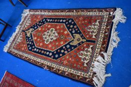 A traditional Persian rug, approx 156 x 92cm