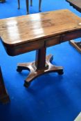 A Victorian rosewood fold over card table