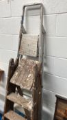Two sets of step ladders, wooden and aluminium