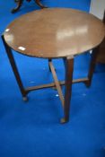 A vintage revertable occasional table