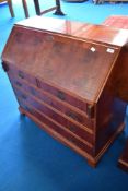 A reproduction Regency style yew wood bureau