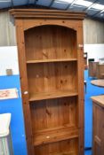 A modern pine tall bookshelf