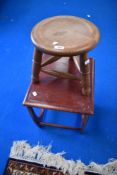 A traditional golden oak tri legged stool and a vintage G plan style occasional table