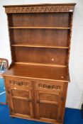 A reproduction Priory style oak dresser