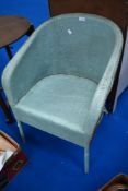 A vintage woven fibre tub chair