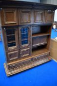A vintage oak Continental style side cabinet of interesting design