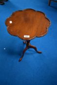 A reproduction wine table having 'flower' top