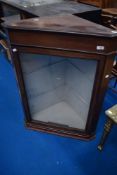 An Edwardian mahogany corner display cabinet