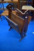 A patented oak magazine rack of interesting design, possibly Arts and Crafts