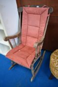 A traditional stained frame rocking chair