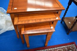A modern yew effect nest of three tables