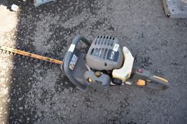 A Ryobi petrol hedge trimmer