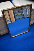 A gilt frame wall mirror, approx 86 x 48cm