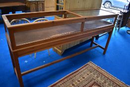 A traditional pine shop display, one glass pane missing, approx width 215cm