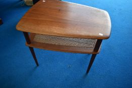 A vintage teak coffee table of small proportions having canework undertier, understood to be