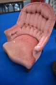A Victorian spoonback chair having later upholstery