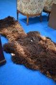 Two brown sheepskin rugs