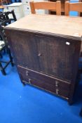 An early to mid 20th Century oak ply side cabinet