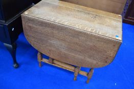 An early 20th Century golden oak twist gateleg dining table