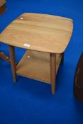 A modern natural wood occasional tabke, similar to Ercol