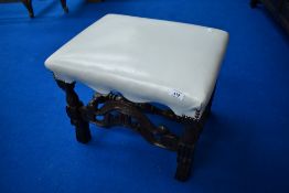 A 19th Century oak frame stool having white/cream leather seat