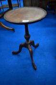 An early 20th Century reproduction mahogany wine table