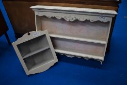 Two modern painted wall shelves