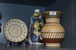 An studio pottery lamp base, of elongated oval form with short flared neck, decorated with