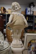 A figurine of a young girl in the style of Mabel Lucie Atwell, approx 59cm in height.